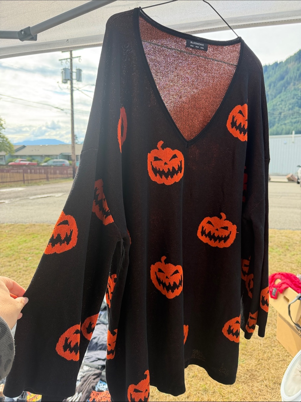 BloomChic Black V-Neck Sweater with Orange Pumpkin Motif